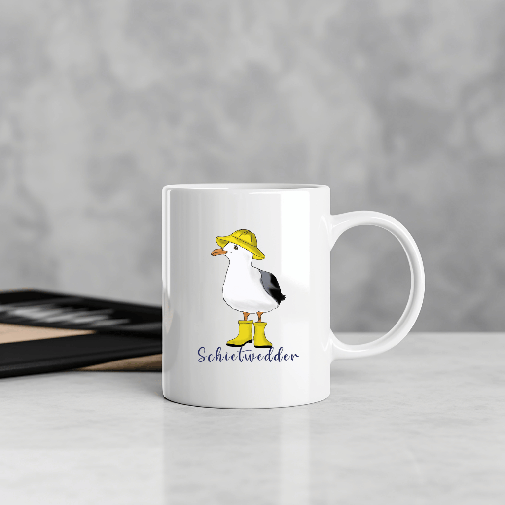 Maritime Kaffeetasse: Möwe im Regenmantel mit Schietwedder-Schriftzug