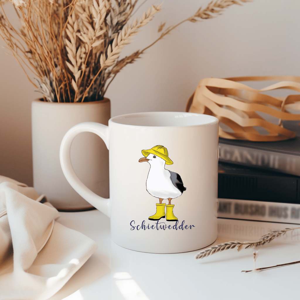 Maritime Kaffeetasse: Möwe im Regenmantel mit Schietwedder-Schriftzug