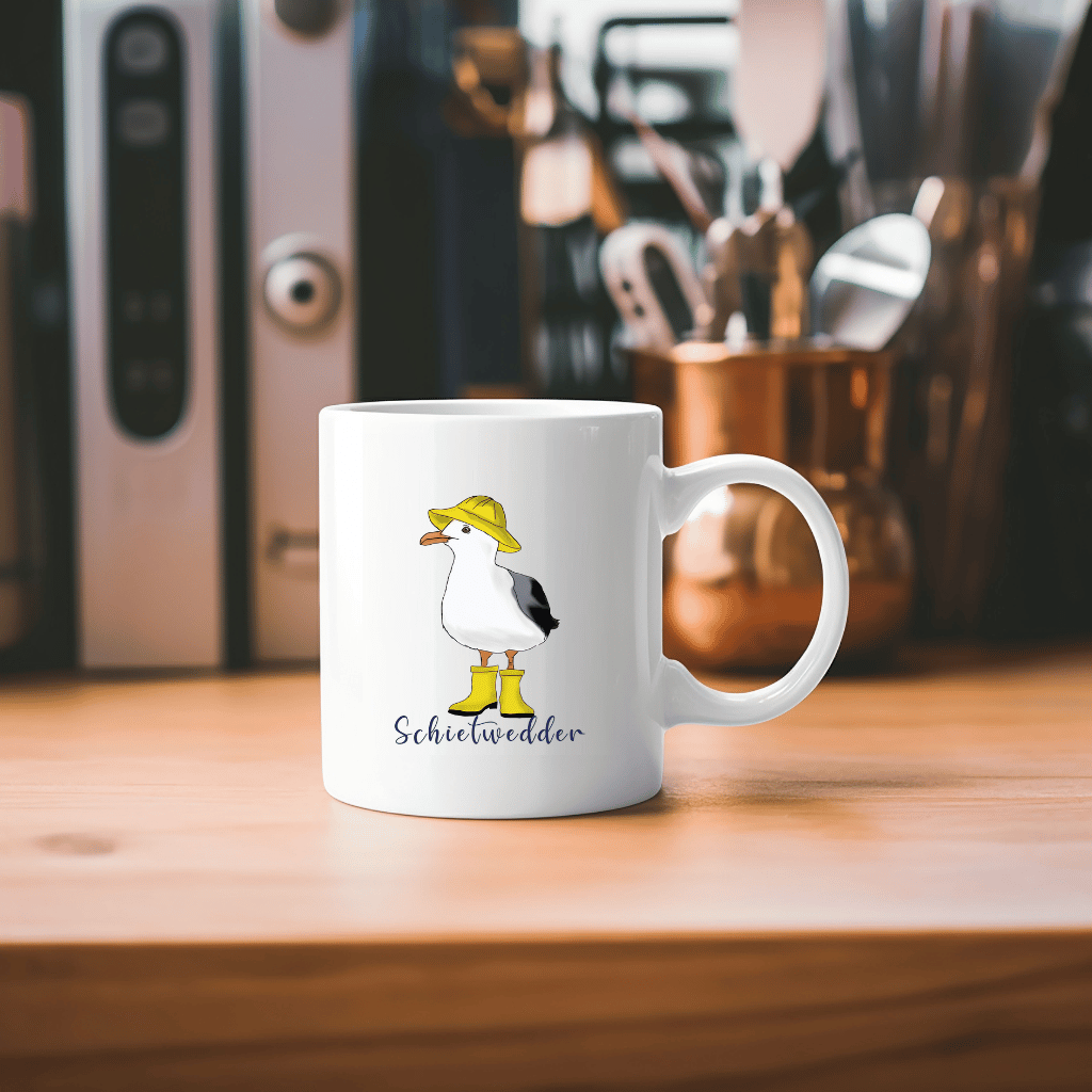 Maritime Kaffeetasse: Möwe im Regenmantel mit Schietwedder-Schriftzug