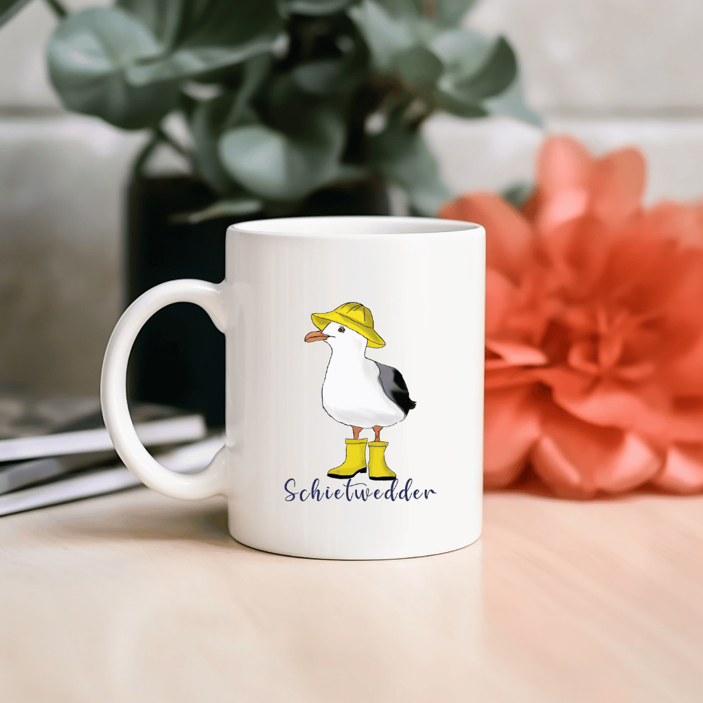 Maritime Kaffeetasse: Möwe im Regenmantel mit Schietwedder-Schriftzug