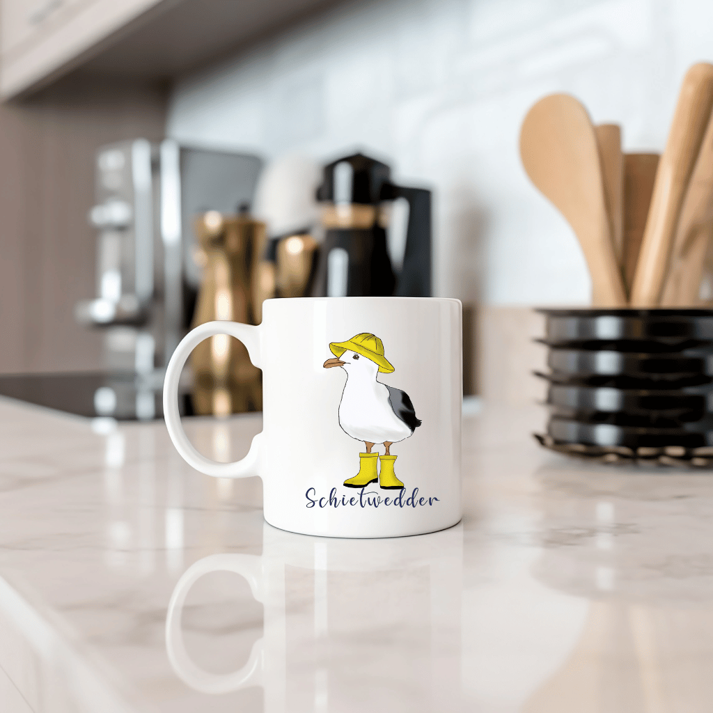 Maritime Kaffeetasse: Möwe im Regenmantel mit Schietwedder-Schriftzug